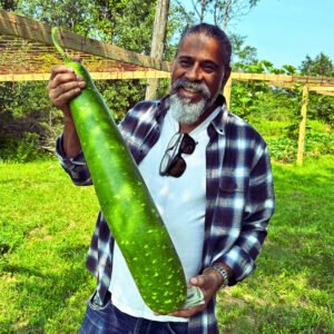 Homegrown bottle gourd harvest with gardeners